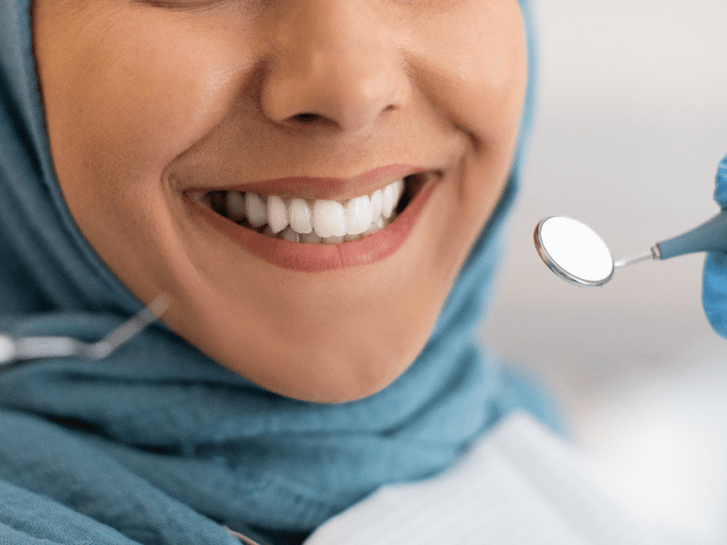dentist checking with dental equipment